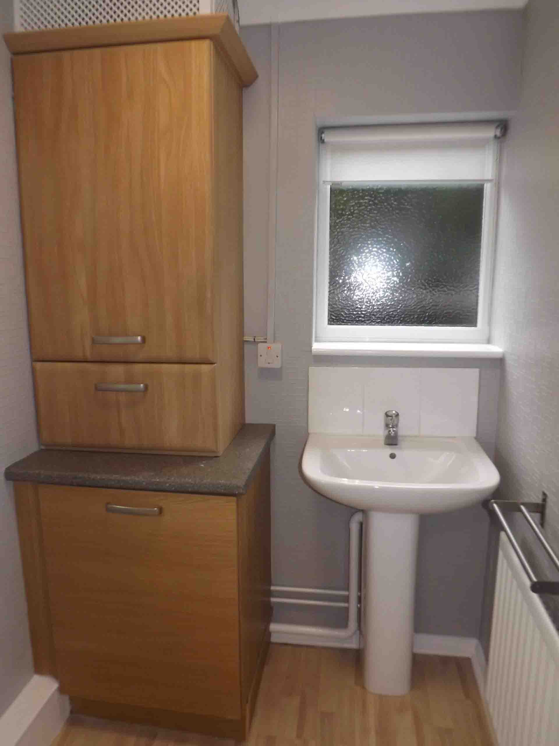 image of sink with cabinet