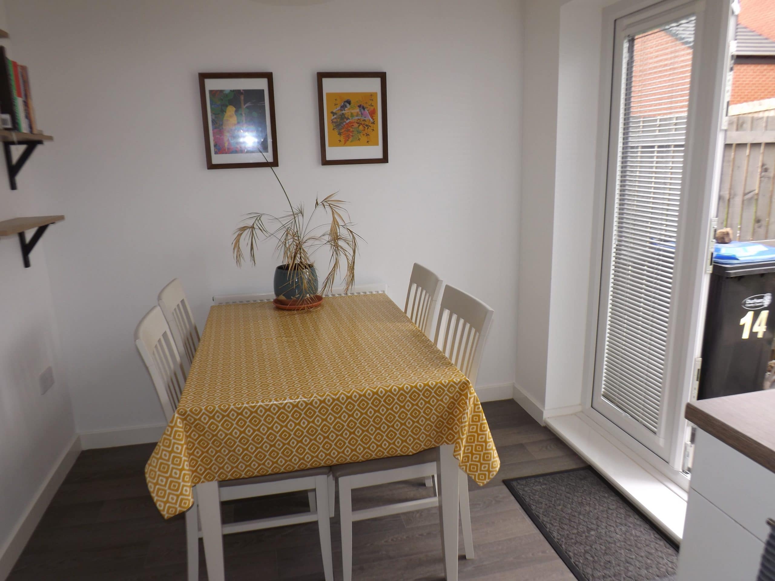 image of dining table with yellow table cover