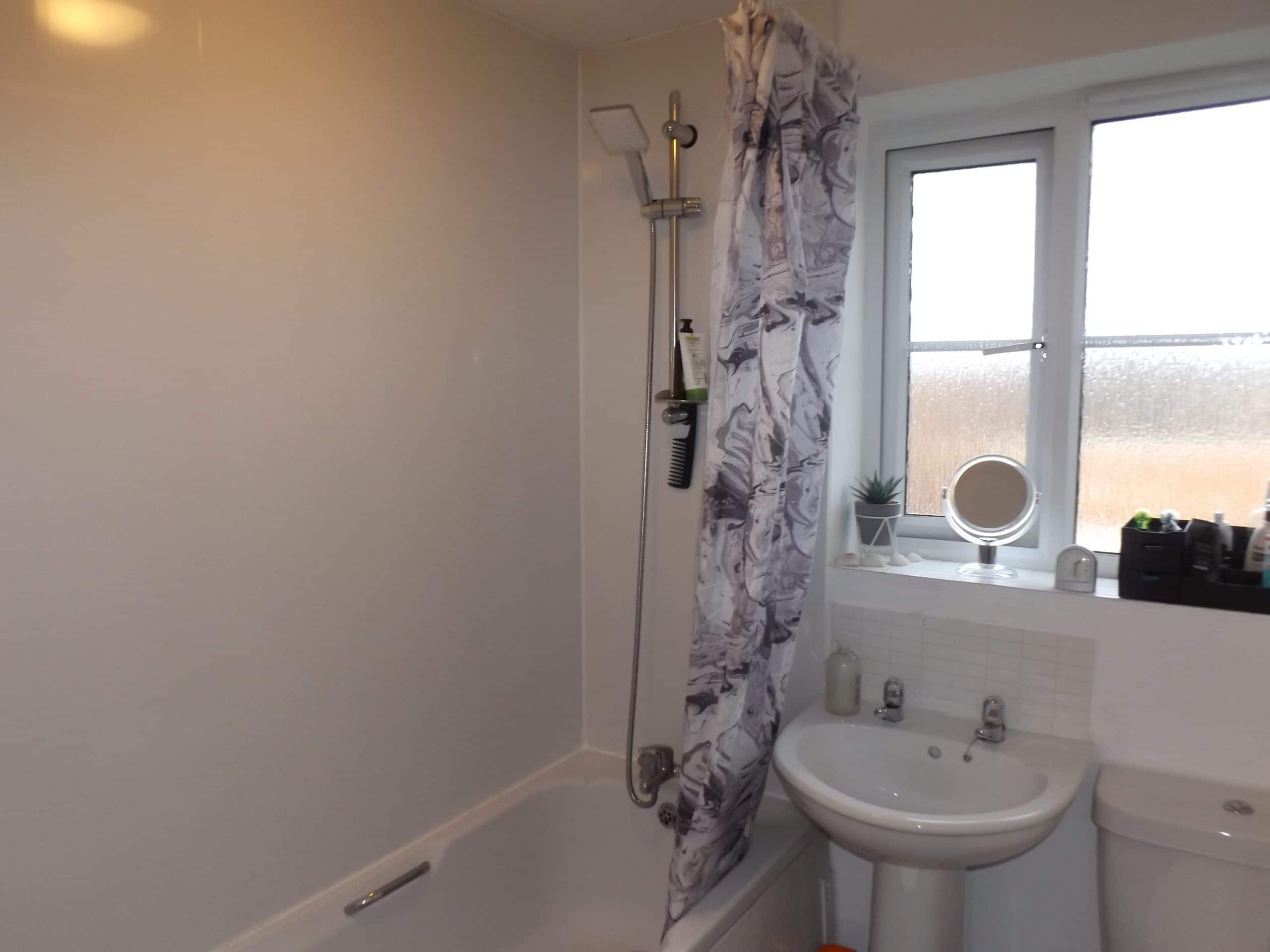 image of bathroom with curtain